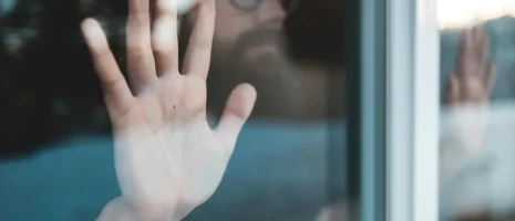 pexels-introspectivedsgn-4134650 Hand pressed against a window.